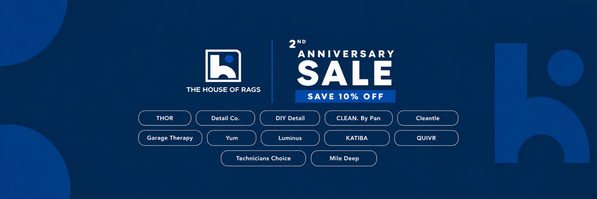 A promotional banner for 'The House of Rags' celebrating its 2nd Anniversary Sale with a 10% off discount. The banner features a dark blue background with abstract blue shapes, white and light blue text, and a grid of small service category labels including THIO3, Detail Co, DIY Detail, Clean by Fan, Climate, Garage Therapy, Yum, Lamination, KATIBA, QUIVER, and Technician Choice.